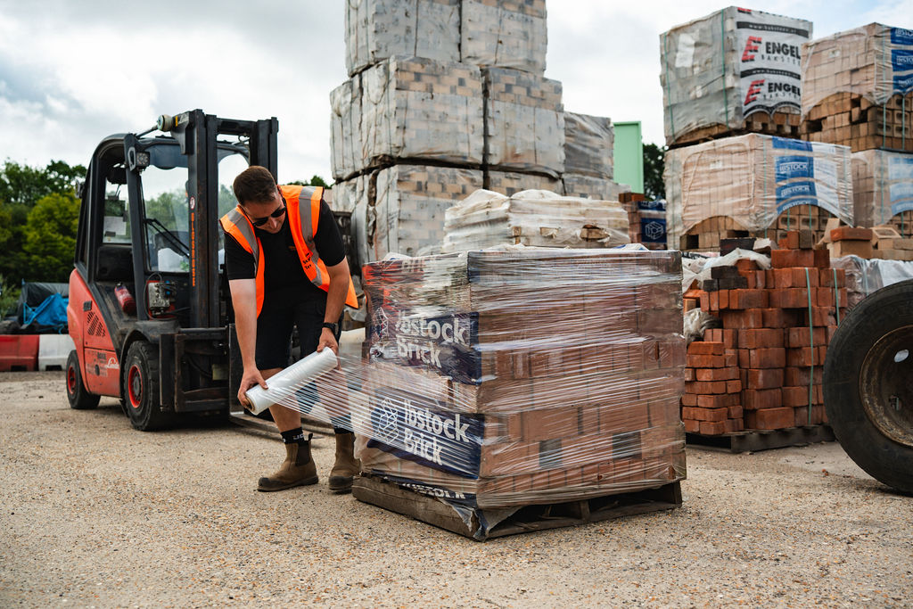 Forklift moving a pack of blocks