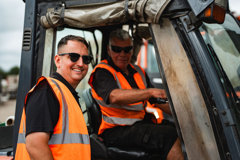 Two of the Steward team in the cab of a forklift