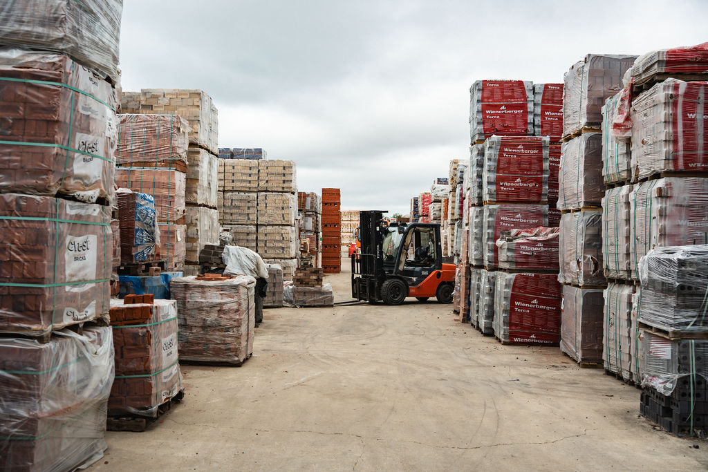 Forklift working between the brick stacks